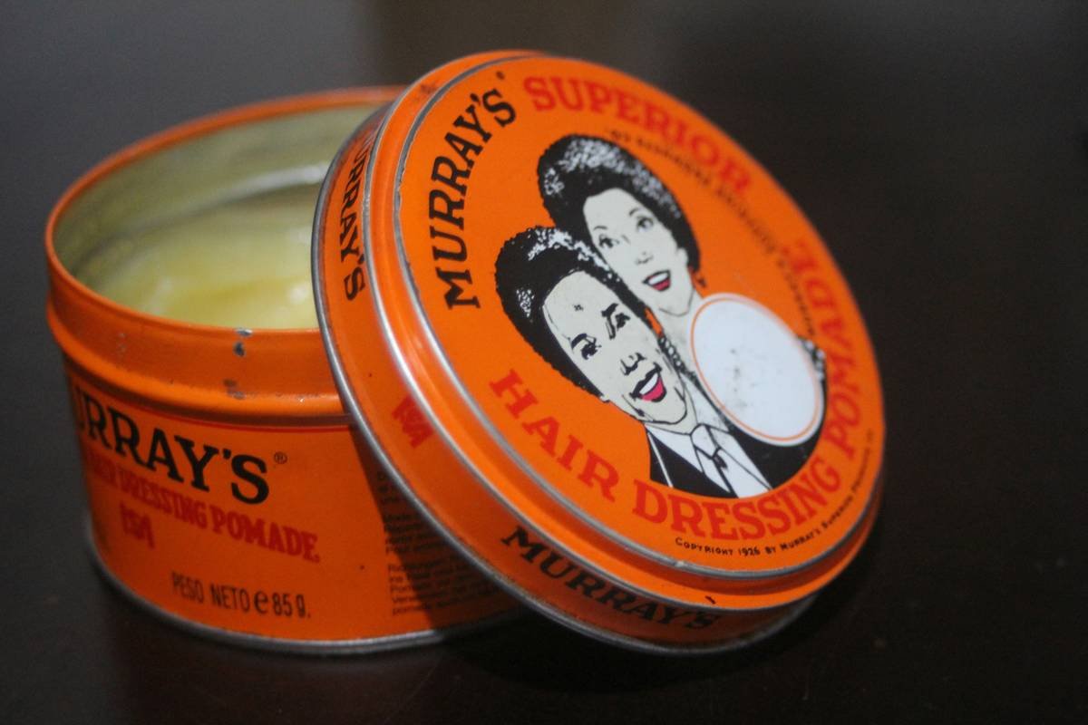 Side-by-side graphic showing uneven balm distribution with fingers vs. even coating with a styling balm applicator brush