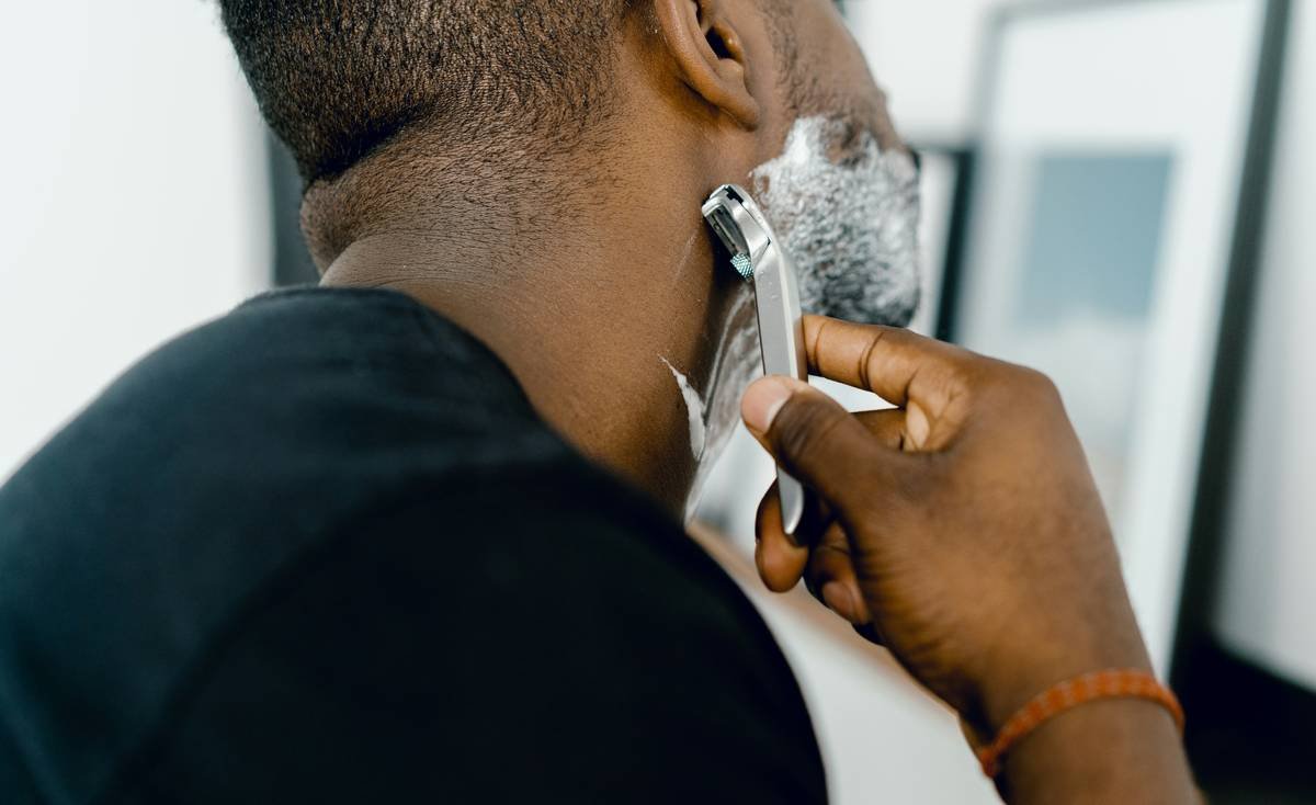 Close-up of high-quality beard dandruff prevention brush with dual-zone boar bristles designed for sensitive skin